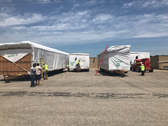 Finding a place to stage modules close to the site is essential. Photo courtesy of David Allen Finding a place to stage modules close to the site is essential. Photo courtesy of David Allen
