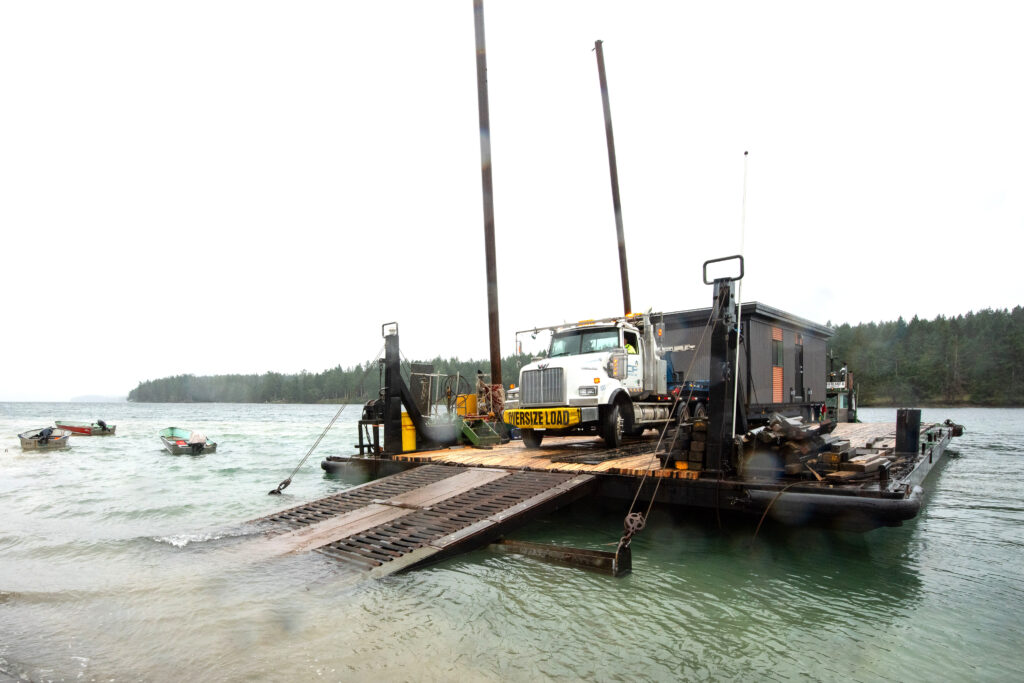 Offloading modules can present all kinds of challenges – in this case, a wet landing onto a beach.
Photo courtesy of CIP Modular
