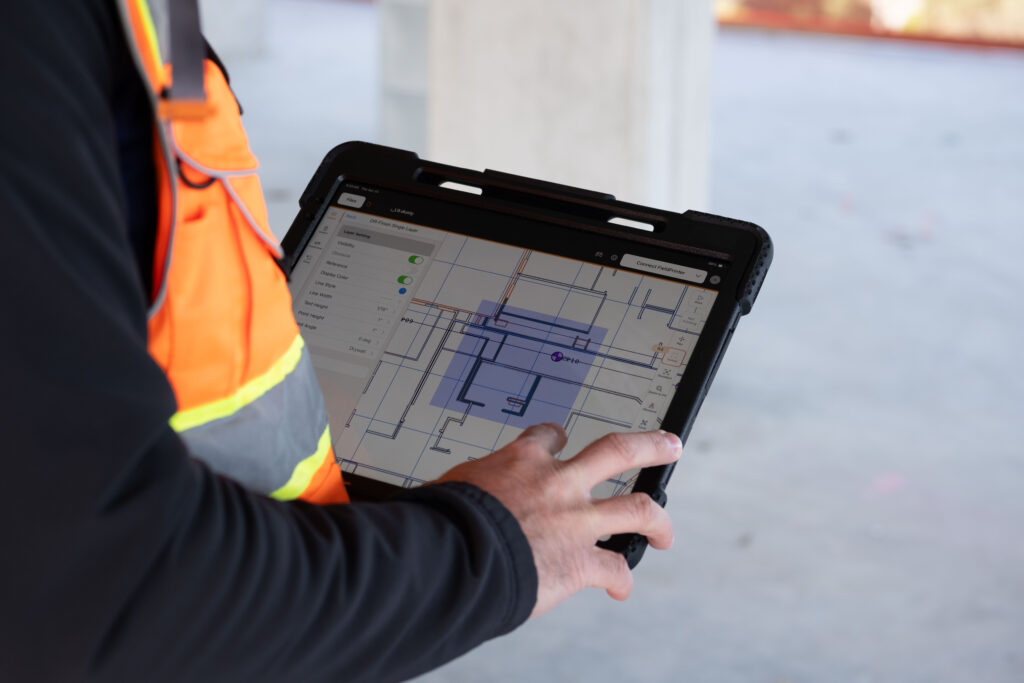 The software for the Dusty FieldPrinter robot is accessed with an iPad on the jobsite. Credit: Dusty Robotics