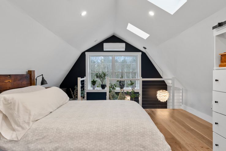 Thoughtful details like this bedroom on a mezzanine level make the most
of a small living space. Courtesy Backyard ADUs