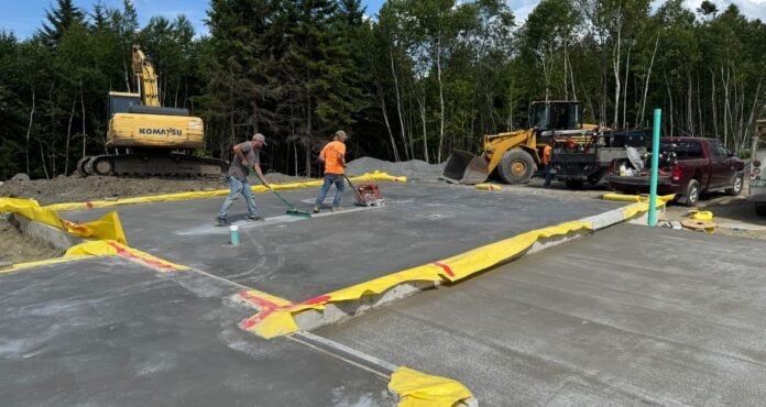 Here you can see the vapor barrier extending out from under the concrete slab, a detail Bensonwood specifies. Credit: Bensonwood
