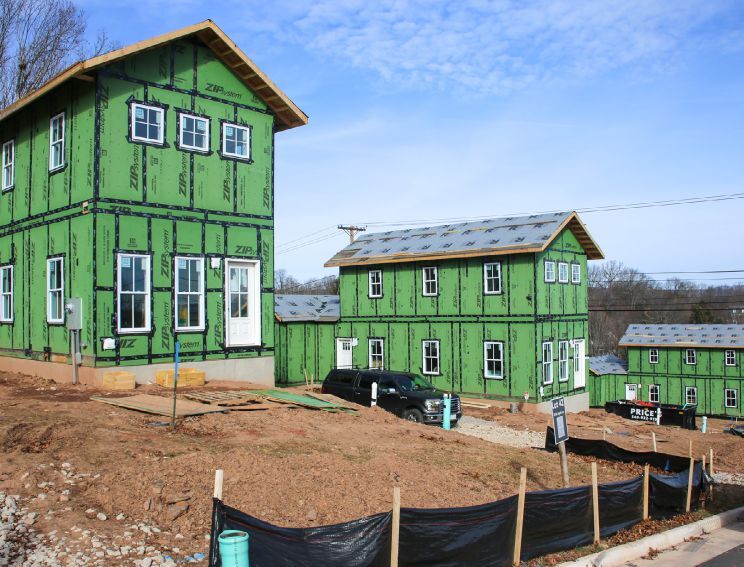 Photo of homes after installation. Homes were set on conditioned crawlspaces on narrow hillside lots. Image courtesy of Community Housing Partners