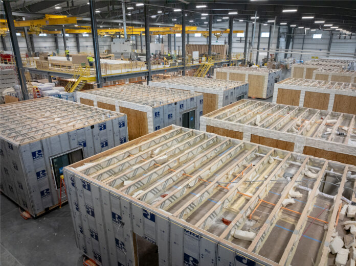 Continuous insulation being installed at Fading West, a modular manufacturer based in Buena Vista, Colorado. Photo: Nick Chumchal