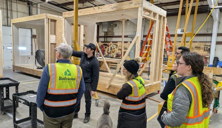 The MIT Humanitarian Supply Chain Lab team touring the microfactory of Reframe Systems, an industrialized construction startup in Andover, Massachusetts. Photo credit: Jarrod Goentzel and Reframe Systems