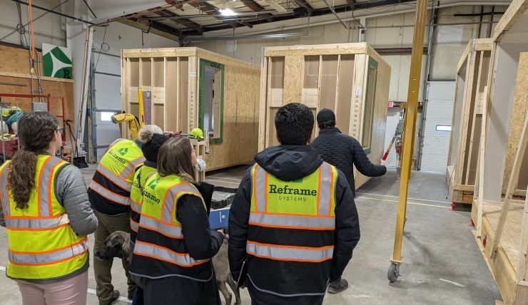 The MIT Humanitarian Supply Chain Lab team touring the microfactory of Reframe Systems, an industrialized construction startup in Andover, Massachusetts. Photo credit: Jarrod Goentzel and Reframe Systems